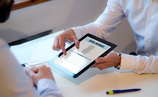 Patient reviewing dental insurance form on tablet