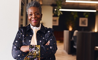 Closeup of senior woman smiling in office
