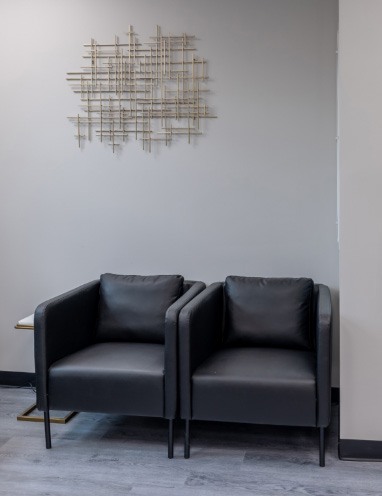 Two black leather armchairs in Edison dental office