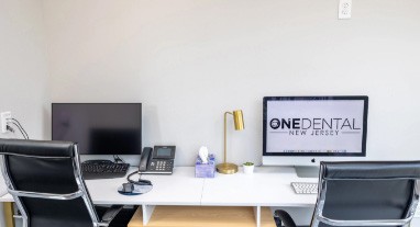 Two computers on desk at One Dental New Jersey