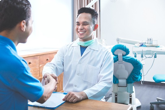 Man smiling at the dentist