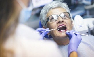 Senior woman receiving a dental exam