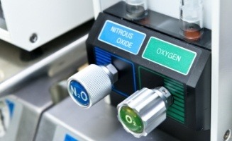 Nitrous oxide and and oxygen buttons on nitrous oxide sedation dentistry machine