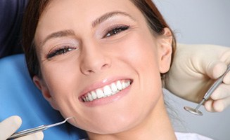 Woman smiling in a dental chair