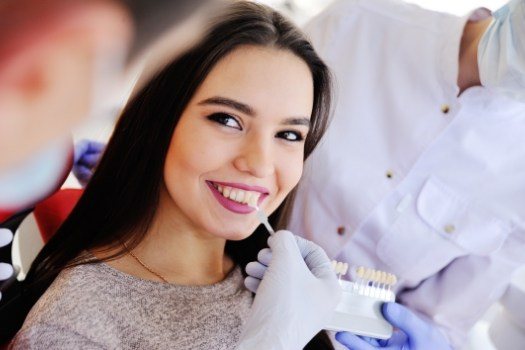 Woman getting dental veneers in Edison from cosmetic dentist