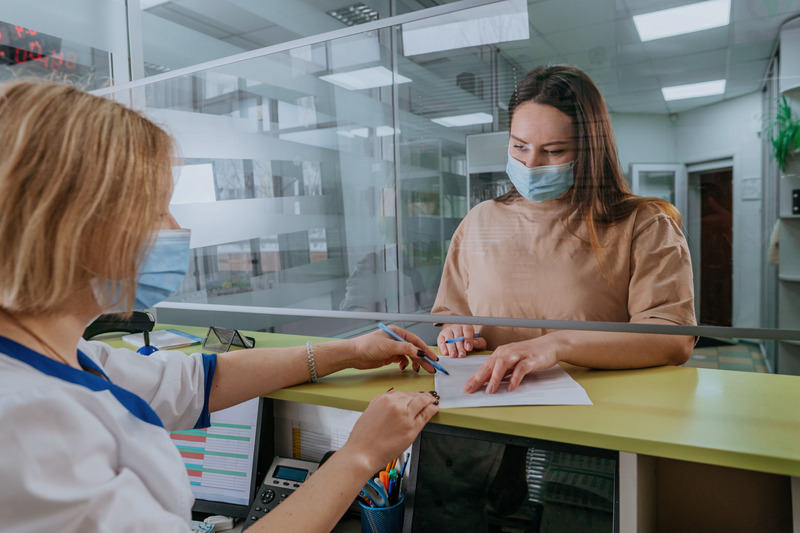 Patient with autoimmune disorder looking at dental insurance
